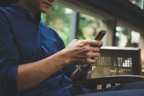 Close up of man using mobile phone. Stock Photos