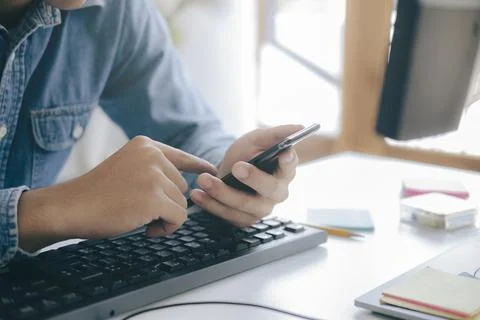 Close up of man using mobile phone. Stock Photos