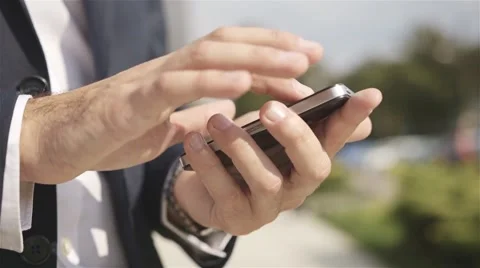 Close up of a man using mobile smart phone outdoor Stock Footage 41855978