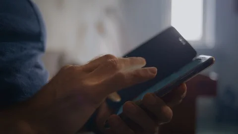 Close up of a man using mobile smart phone Stock Footage 124239983