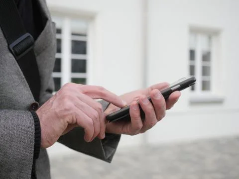 Close up of a man using mobile smart phone Stock Photos