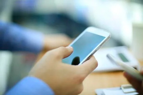 Close up of a man using mobile smart phone Stock Photos