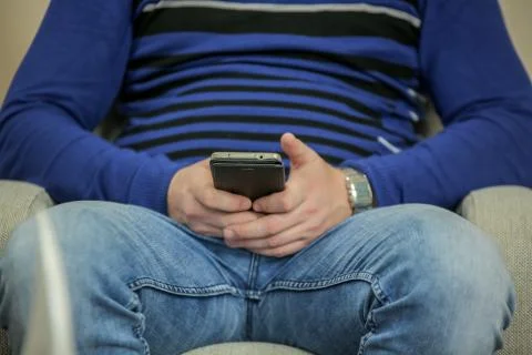 Close up of a man using mobile smart phone indoors Stock Photos