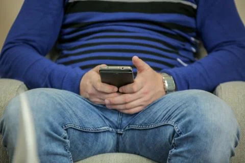 Close up of a man using mobile smart phone indoors Stock Photos