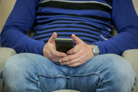 Close up of a man using mobile smart phone indoors Stock Photos