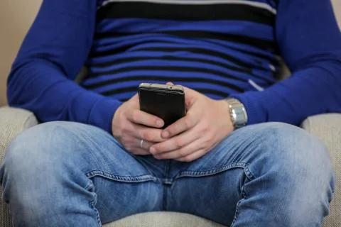 Close up of a man using mobile smart phone indoors Stock Photos
