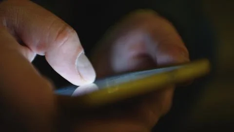 Close up of a man using mobile smart phone 写真素材