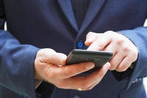 Close up of a man using mobile smart phone Stock Photos