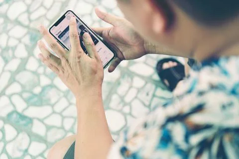 Close up of a man using mobile smart phone make money Stock Photos