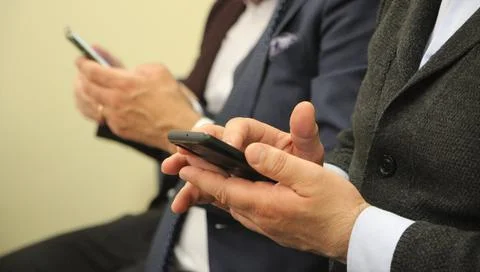 Close up of a man using mobile smart phone. Communication business concept Stock Photos