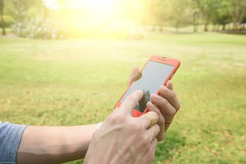 Close up of a man using mobile smart phone outdoor Stock Photos