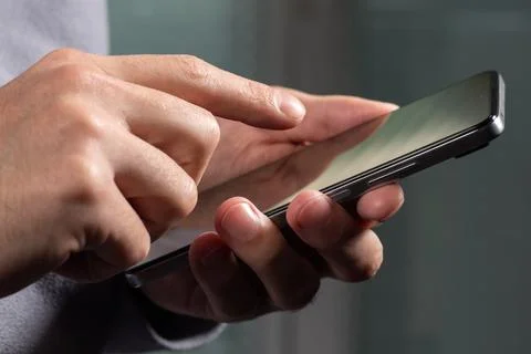 Close up of a man using mobile smart phone Stock Photos