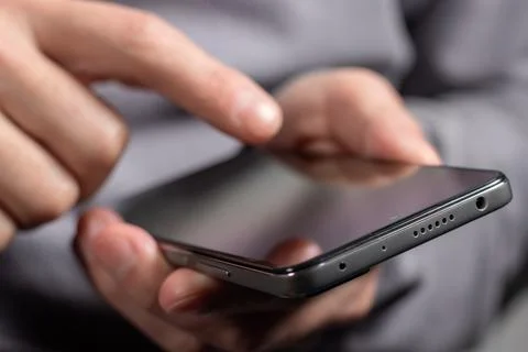 Close up of a man using mobile smart phone Stock-Fotos