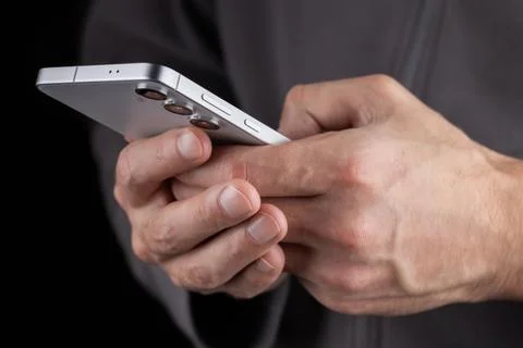 Close up of a man using mobile smart phone 写真素材