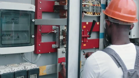 Close up of man using multimeter for work on solar station. African american Stock Footage 168916567
