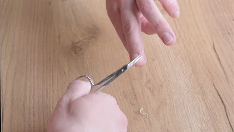 Close up of a man using a nail scissors to cut his nails. Personal care concept Stock Footage 199473944