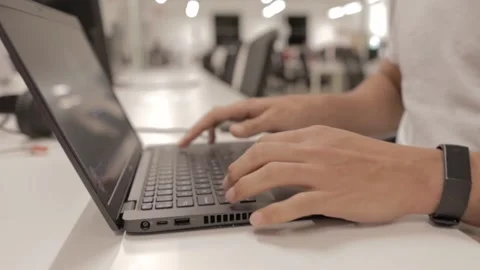 A close up of a man using a portable computer at an office Stock Footage 169601736