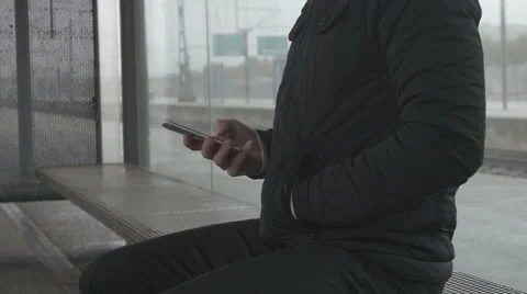 Close-up of a man using smart phone at train station Stock Footage 68679068