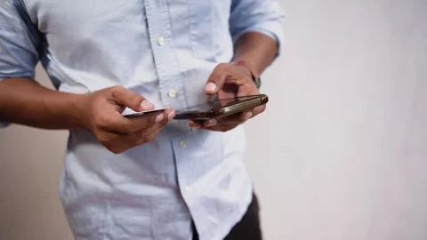 Close-up of man using smart phone for online shopping with credit card. Stock Footage 268733652