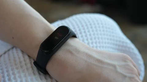Close-up of a man using a smart watch measures his pulse. Pulse checker app Stock Photos