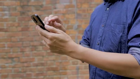 Close up of a man using a smartphone, outdoor, daytime Video stock 150342037