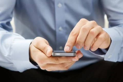 Close up of a man using smartphone Stock Photos
