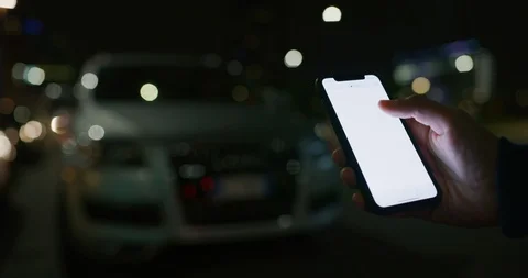 Close up of a man is using a smartphone as remote control of self pilot. Video stock 121557713