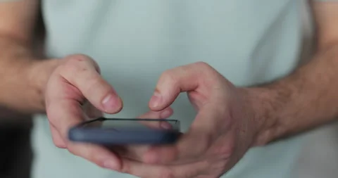 Close up man using social media application on smartphone text messages Stock Footage 302274101