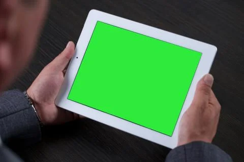 Close up of man using tablet. Green screen. Stock Photos
