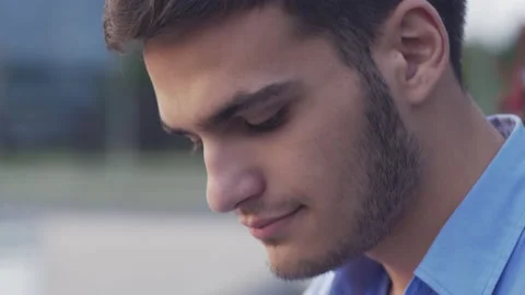 Close-up of man using a tablet outside in the park Stock Footage 133111669