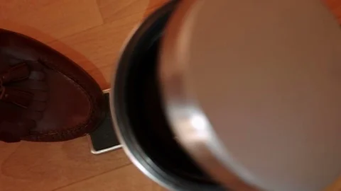 Close-up on a man using trash can and tossing crumpled paper with studio light Stock Footage 77409431