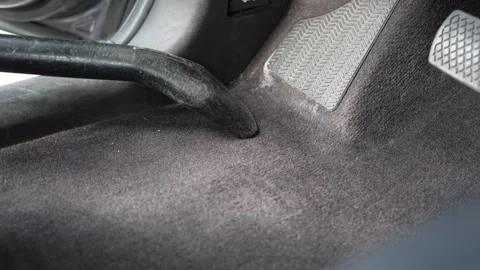 Close Up Man Vacuuming Car Interior Driver Side Floor 4K 库存影片 336448514