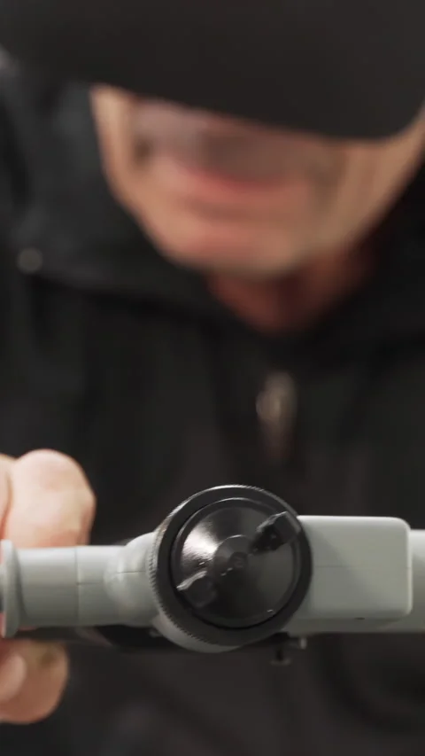 Close up of a man in VR glasses holding automatic paint sprayer. Scene Stock Footage 286052731