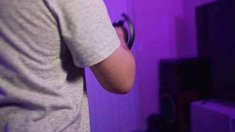 Close up of man in VR headset immersed in virtual reality Stock Footage 334090098