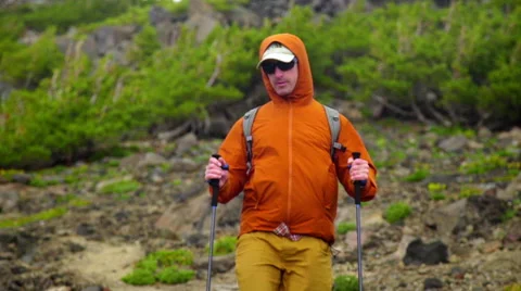Close up of man walking down hill Stock Footage 59517643
