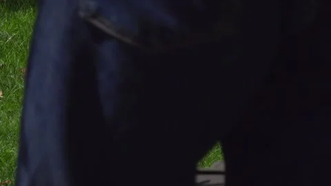 Close-up of a Man Walking Into Frame Pushing an Electric Mower Stock-Footage 345006708