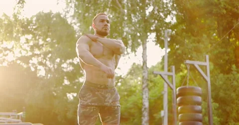 Close up of man warming up muscles before intense training in nature early Stock Footage 157093796