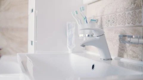 Close up man wash hands without soap in bathroom. Morning routine hygiene Stock Footage 127020218