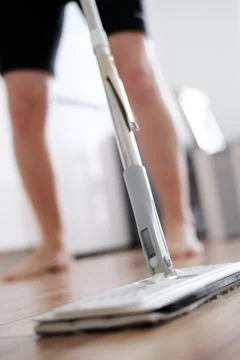 Close-up as a man washes the floor Stock Photos