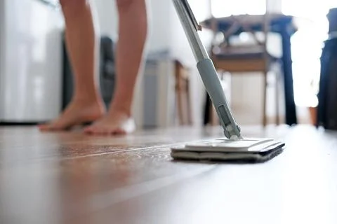 Close-up as a man washes the floor Stock Photos