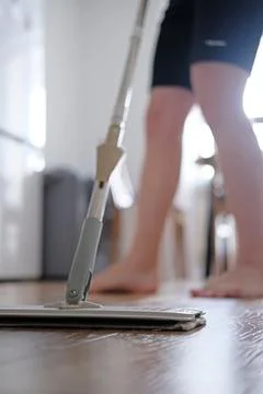 Close-up as a man washes the floor Stock Photos
