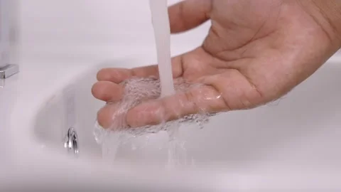Close up man washing hands with soap cleaning water. Stock Footage 152748895