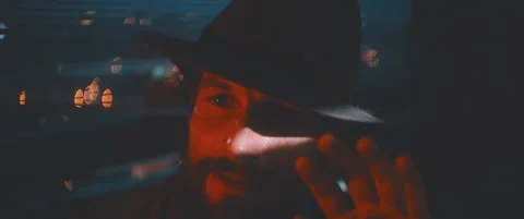 Close up of man waving through shutter and red lights using vintage camera Stock Footage 203568952