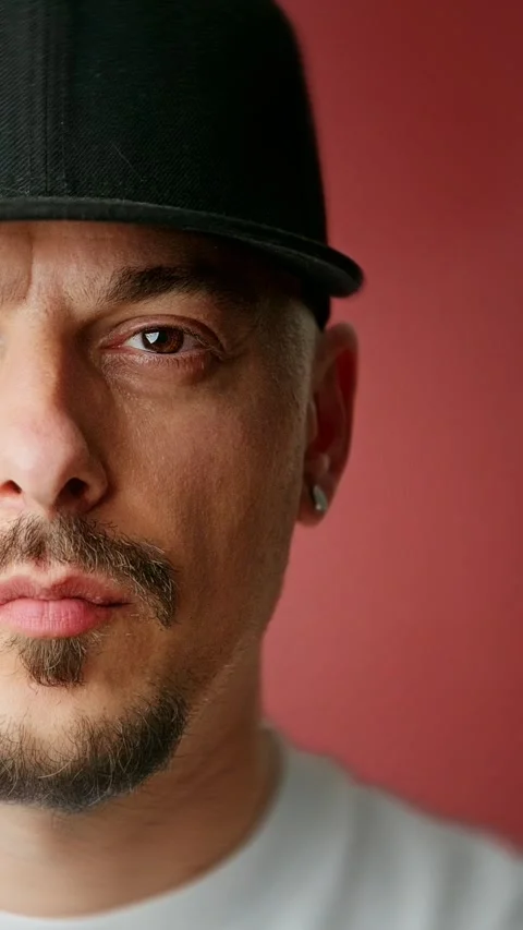 Close-up of a man wearing a black cap with a goatee. Stock Footage 292496699