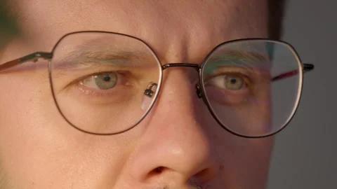 Close up of man wearing glasses working at computer Stock Footage 316550474