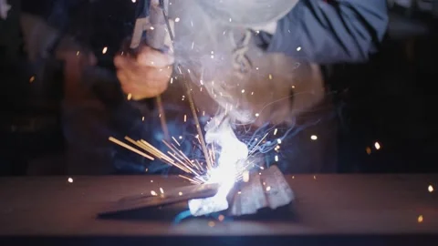 Close up of man welding metal in workshop Stock Footage 174710842