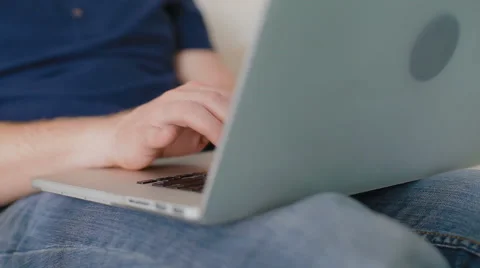 Close-up of the man which prints something on the laptop. Video stock 62519163