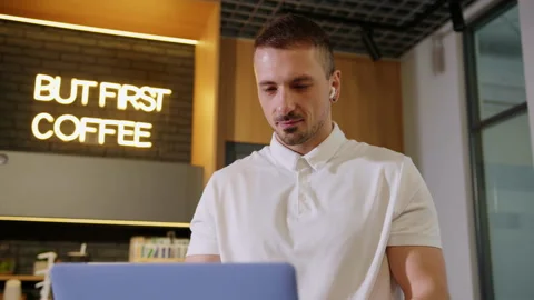 Close-up of a man who opens a laptop for a video conference in the office Stock Footage 195209384