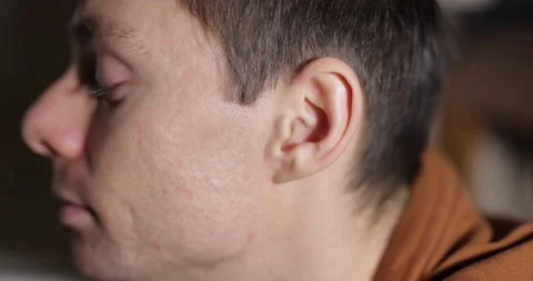 Close up man wiggles his ears Stock Footage 146470004