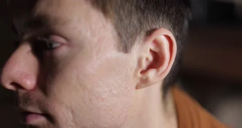 Close up man wiggles his ears Stock Footage 146470596
